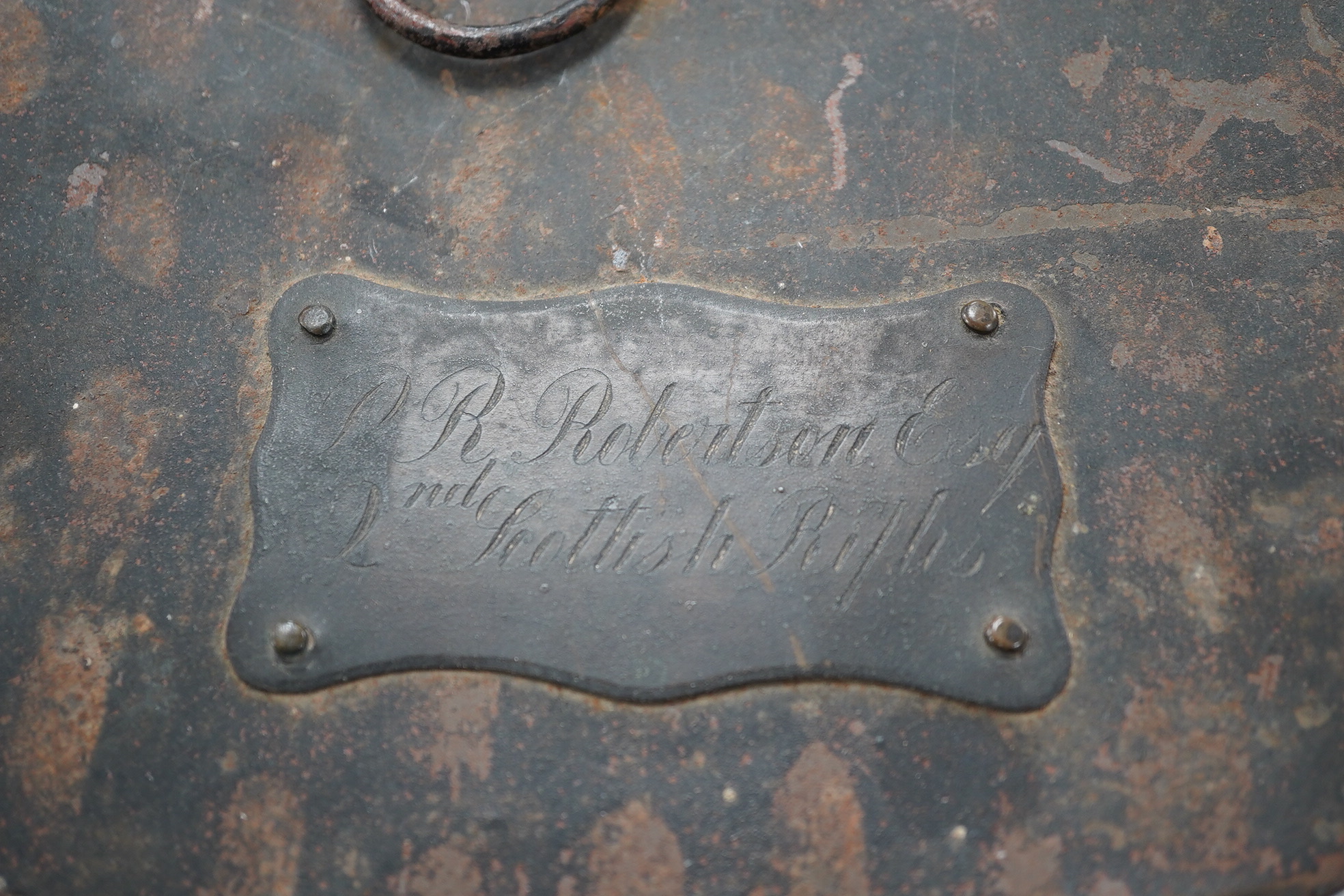 A Victorian tin cased Scottish Rifles officer's shako by Cater & Co. Pall Mall, London, with cap badge for the Cameronians, Applied plaque to lid engraved R. Robertson Esq. 2nd Scottish Rifles. Condition - fair to good,